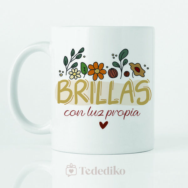 Taza de cerámica blanca con estampado a color "Brillas con luz própia" Diseño con flores.